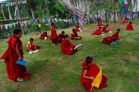 Young monks doing their daily lessons